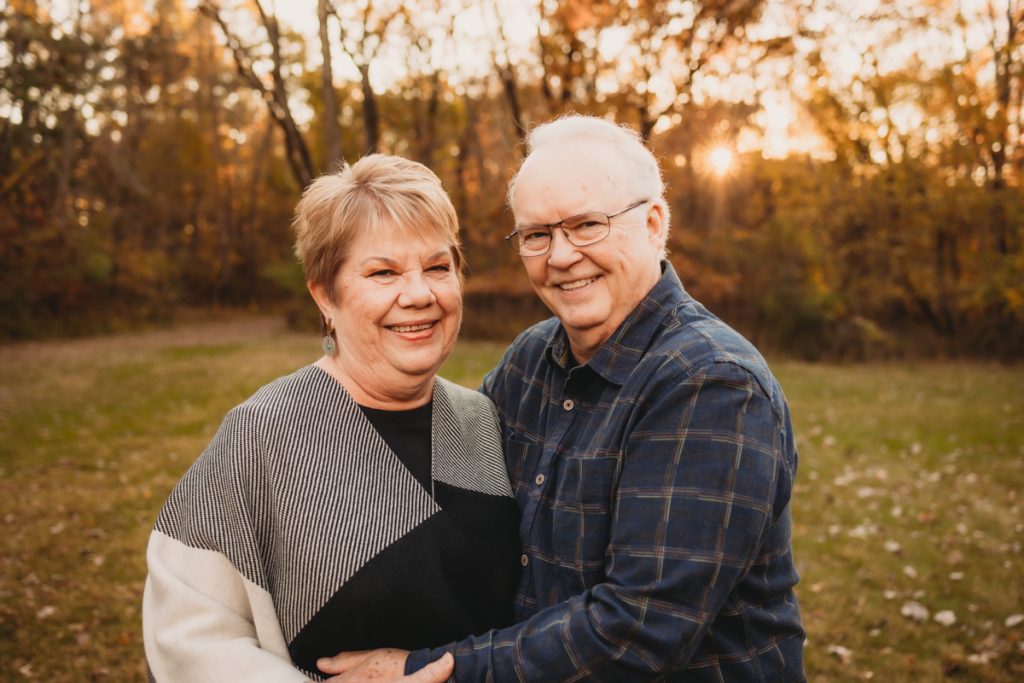 Senior couple looking at camera during family photography session