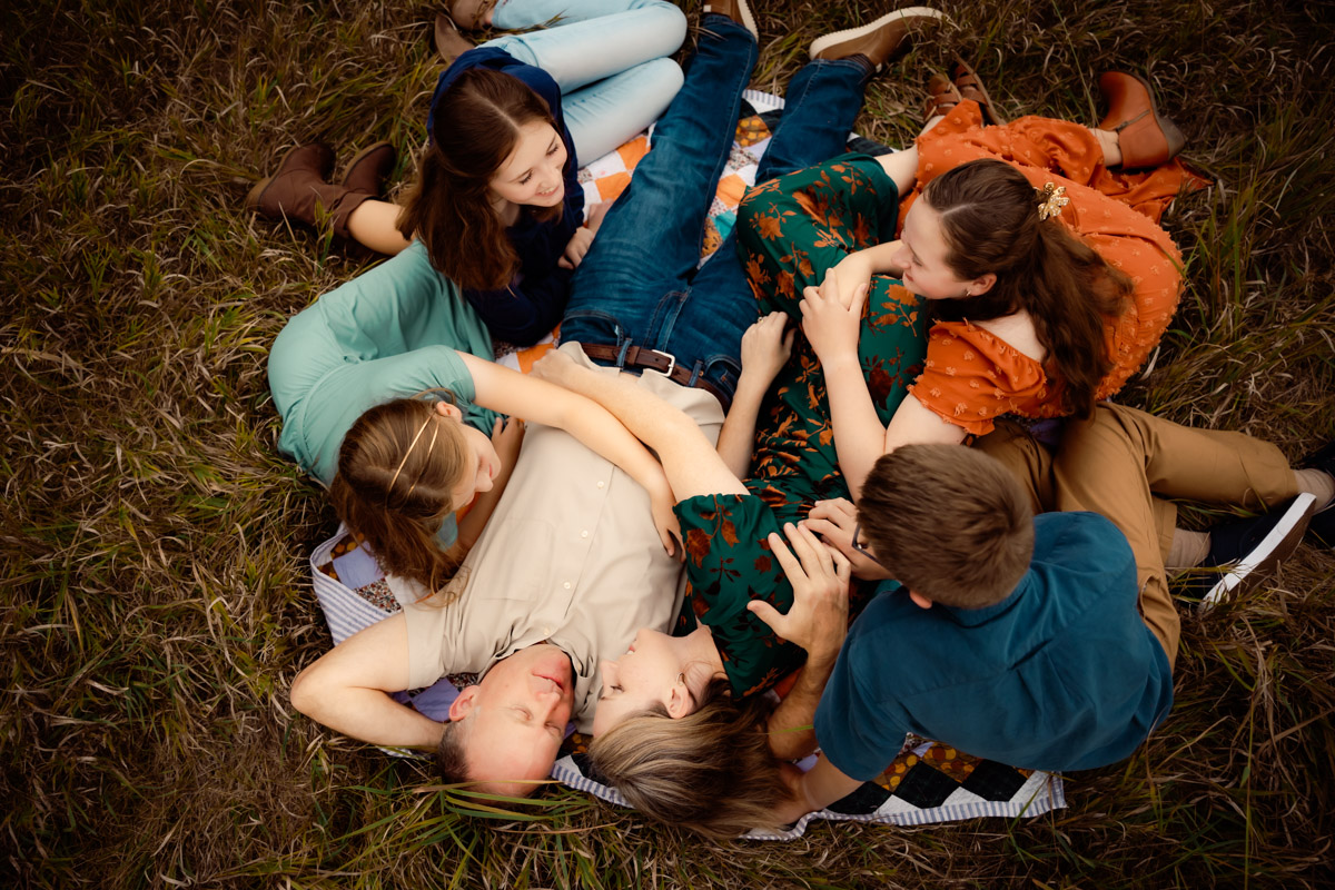 Family lying on a blanket