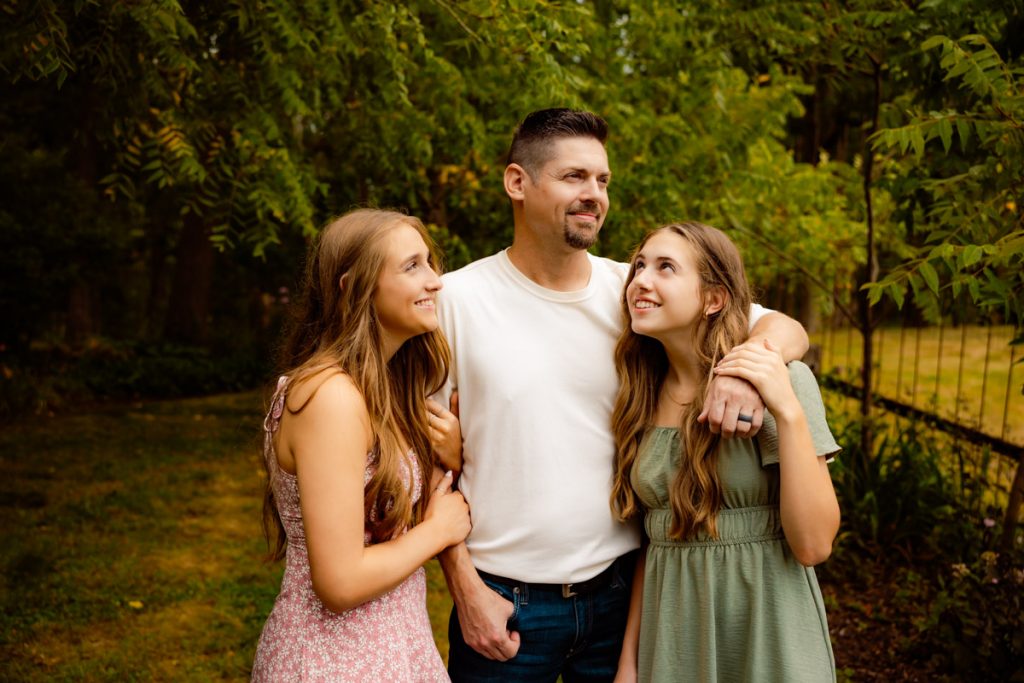 Dad with his two teenage daughters