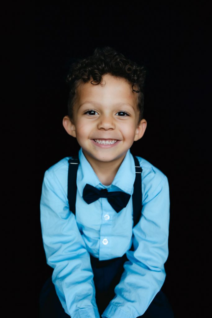 Fine Art School Photography Little boy in suspenders and bow tie