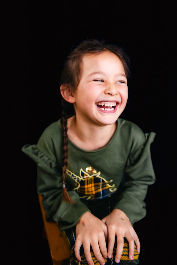 Fine Art School Photography Young girl looking to her left and laughing
