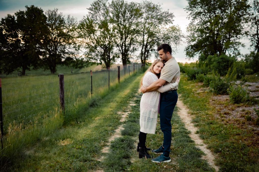 Best timing for family pictures: A month-by-month guide Husband standing with wife in an embrace